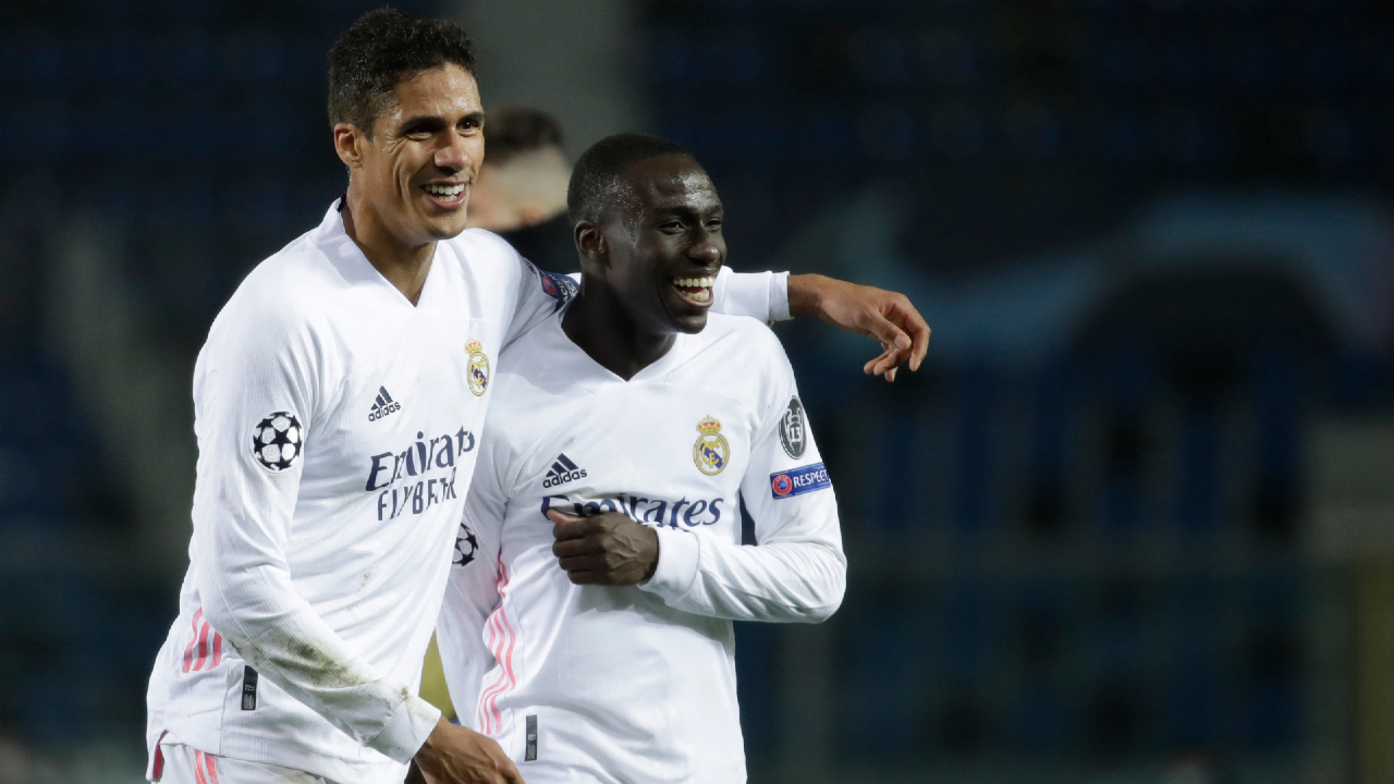 Real Madrid's Ferland Mendy, right, celebrates with Real Madrid's Raphael Varane end of the Champions League, round of 16, first leg soccer match between Atalanta and Real Madrid, at the Gewiss Stadium in Bergamo, Wednesday, Feb. 24, 2021. (Luca Bruno/AP)

