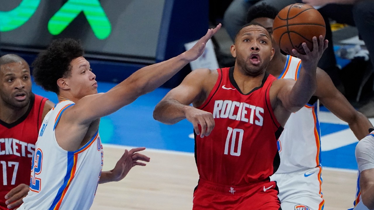 Houston Rockets guard Eric Gordon (10) goes to the basket in front of Oklahoma City Thunder forward Isaiah Roby, left, in the second half of an NBA basketball game. (Sue Ogrocki/AP)