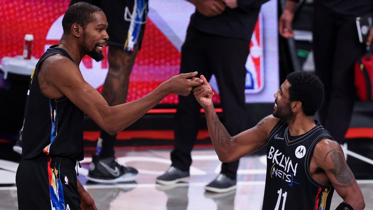 The Nets' Kevin Durant (L) and Kyrie Irving celebrate. (EPA/JUSTIN LANE SHUTTERSTOCK)