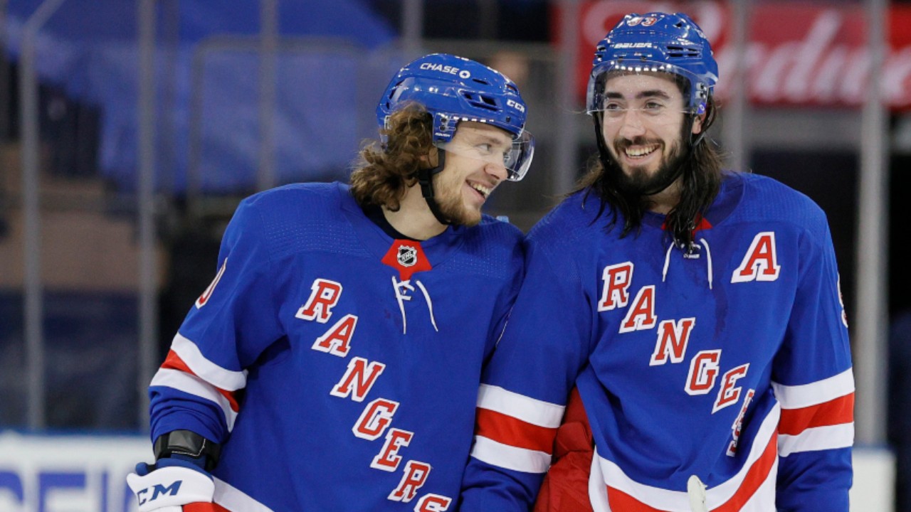 New York Rangers' Artemi Panarin (10) and Mika Zibanejad (93) smile during the third period of an NHL hockey game against the Pittsburgh Penguins at Madison Square Garden, Monday, Feb. 1, 2021, in New York. (Sarah Stier/Pool Photo via AP)