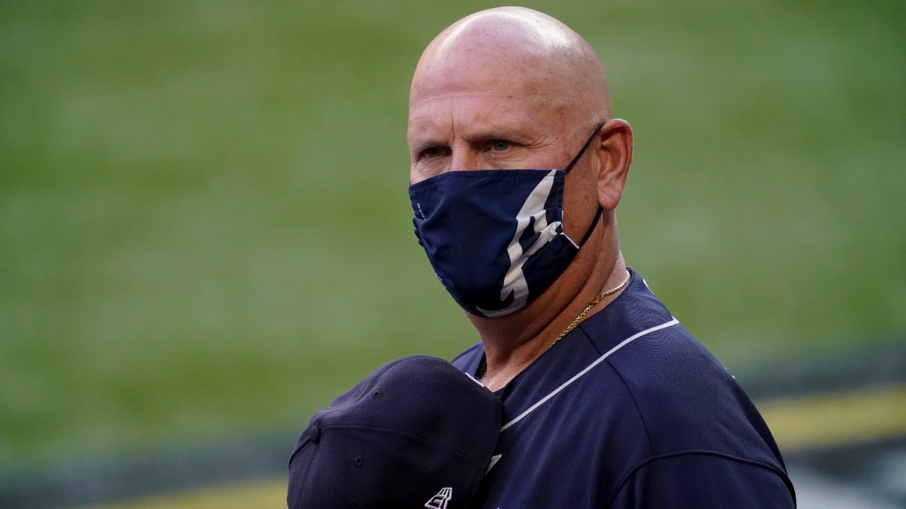 Atlanta Braves manager Brian Snitker lines up for the national anthem before Game 2 of a baseball National League Championship Series against the Los Angeles Dodgers. (Tony Gutierrez/AP)
