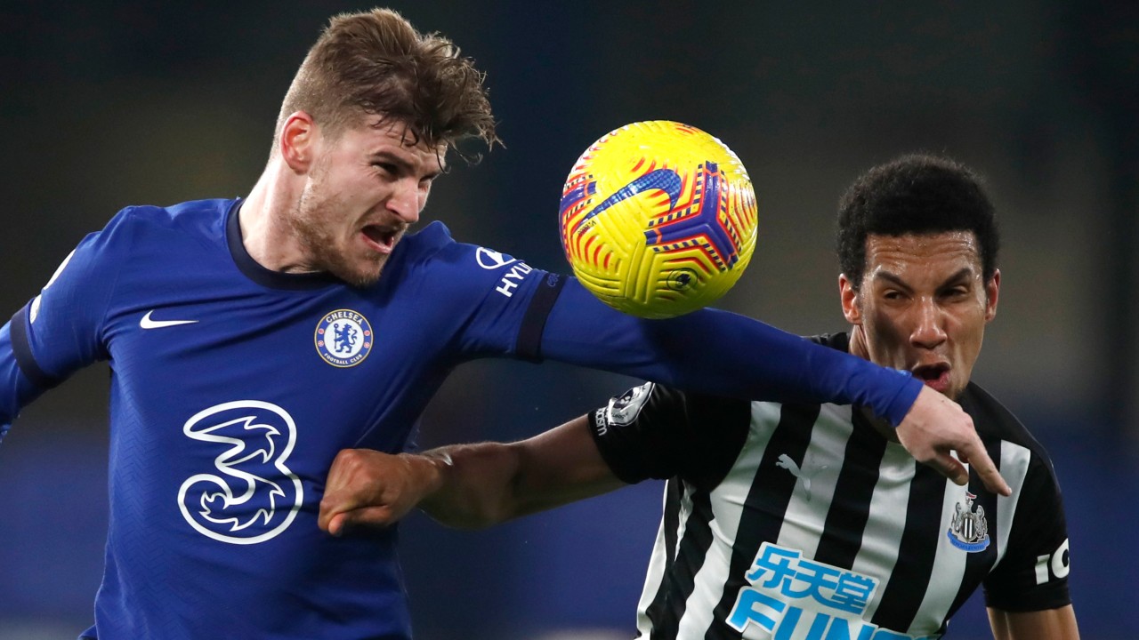 Chelsea's Timo Werner, left, and Newcastle's Isaac Hayden challenge for the ball during the English Premier League soccer match between Chelsea and Newcastle United. (Paul Childs/Pool via AP)