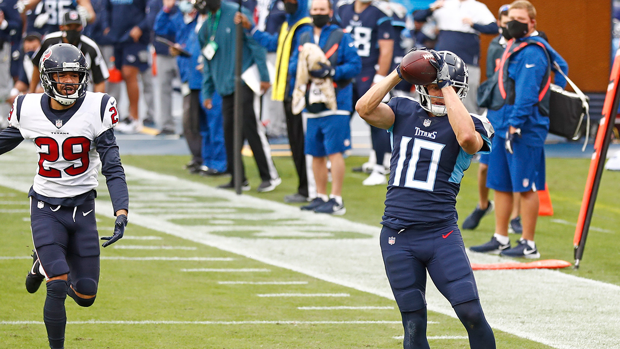 Tennessee Titans wide receiver Adam Humphries (10) catches a touchdown pass ahead of Houston Texans cornerback Phillip Gaines (29) in the first half of an NFL football game Sunday, Oct. 18, 2020, in Nashville, Tenn. (Wade Payne/AP)