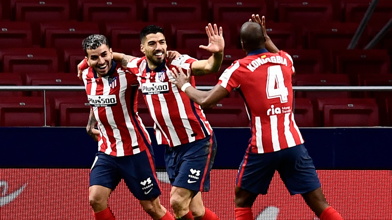 Atletico Madrid's Luis Suarez, center, celebrates with teammates after scoring during a La Liga soccer match between Atletico Madrid and Celta at the Wanda Metropolitano stadium in Madrid, Spain, Monday, Feb. 8, 2021. (Jose Breton/AP)