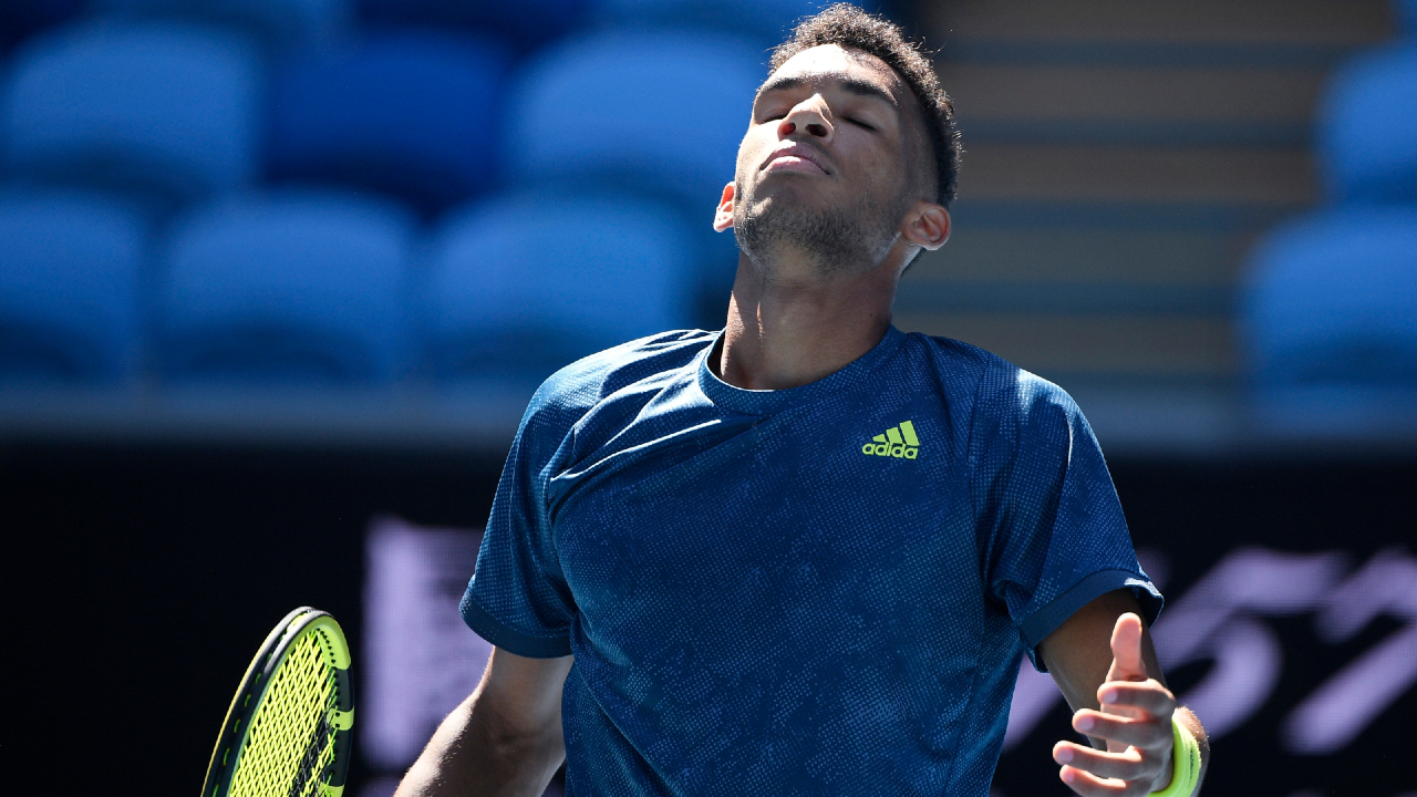 Canada's Felix Auger-Aliassime throws his head back while playing Russia's Aslan Karatsev during their fourth round match at the Australian Open tennis championships in Melbourne, Australia, Sunday, Feb. 14, 2021. (Andy Brownbill/AP)