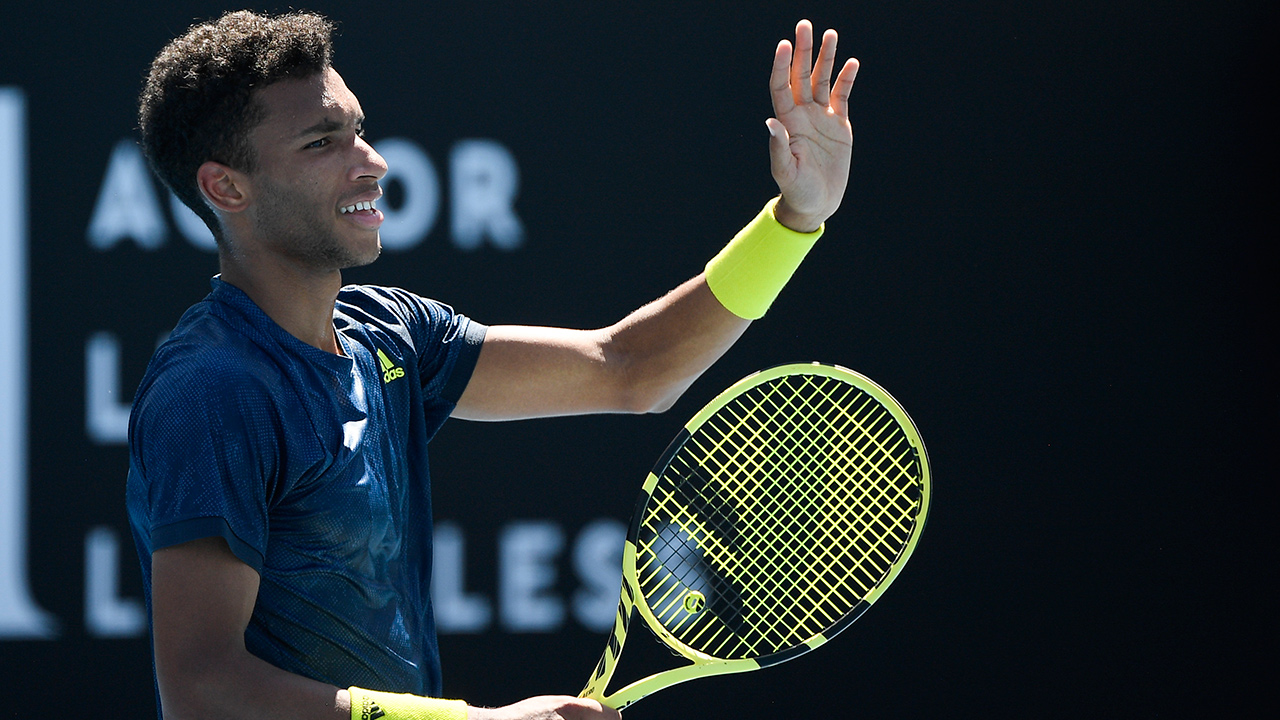 Canada's Felix Auger-Aliassime celebrates after defeating Australia's James Duckworth in their second round match at the Australian Open tennis championship in Melbourne, Australia, Wednesday, Feb. 10, 2021. (Andy Brownbill/AP)
