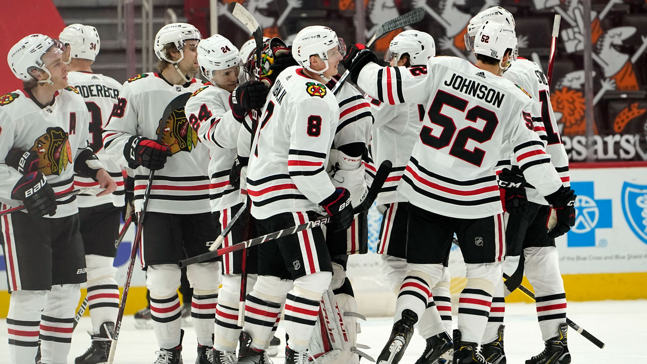 Chicago Blackhawks left wing Dominik Kubalik (8) celebrates scoring against the Detroit Red Wings in overtime during an NHL hockey game. (Paul Sancya/AP)