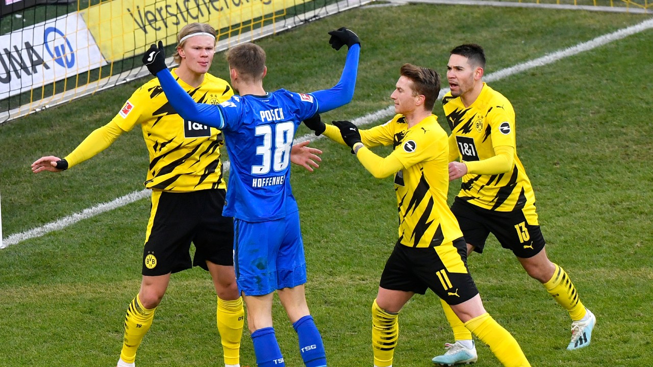 Hoffenheim's Stefan Posch argues with Dortmund's Erling Haaland, left, during the German Bundesliga soccer match between Borussia Dortmund and TSG 1899 Hoffenheim in Dortmund, Germany, Saturday, Feb. 13, 2021. (Martin Meissner/Pool via AP)