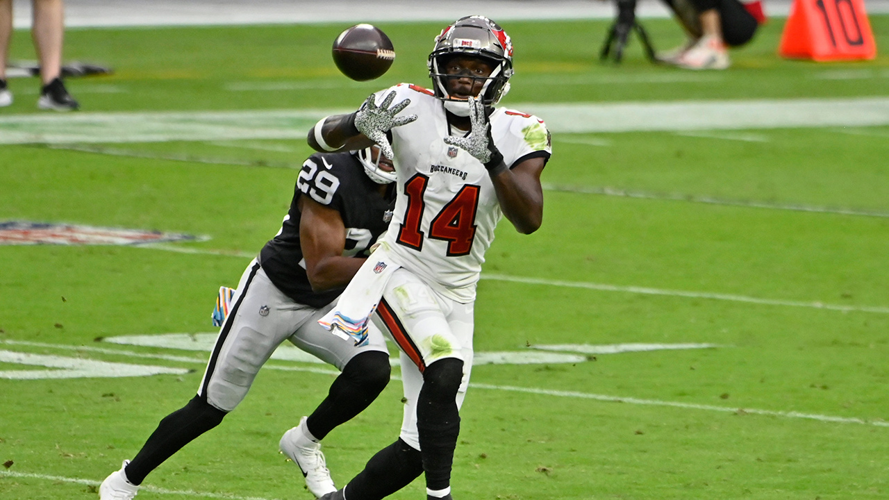 Tampa Bay Buccaneers wide receiver Chris Godwin (14) catches a pass against Las Vegas Raiders free safety Lamarcus Joyner (29) during the first half of an NFL football game, Sunday, Oct. 25, 2020, in Las Vegas. (David Becker/AP)