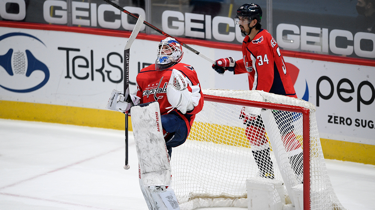 Washington Capitals goaltender Vitek Vanecek, front, celebrates after the team's game against the New York Islanders, Thursday, Jan. 28, 2021, in Washington. (Nick Wass/AP)