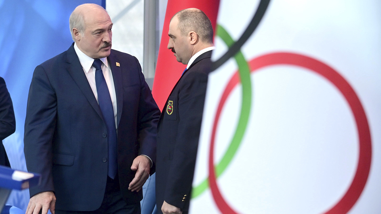 Belarusian President Alexander Lukashenko, left, speaks with his oldest son Viktor in Minsk, Belarus, Friday, Feb. 26, 2021. (Andrei Stasevich/BelTA Pool Photo via AP)