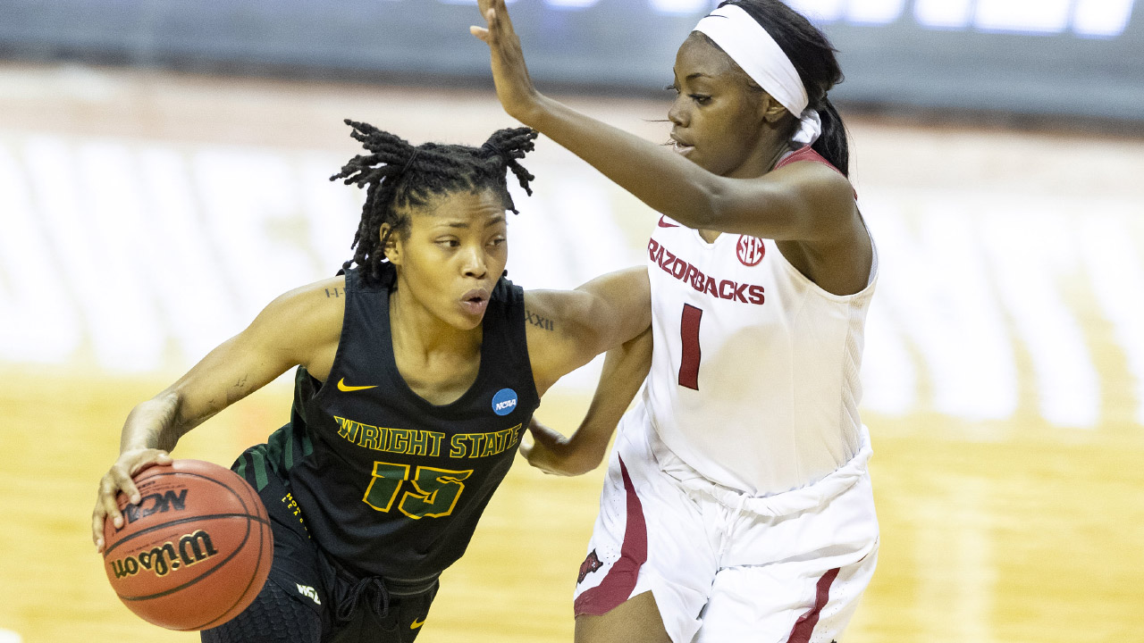 Wright State guard Angel Baker (15) drives around Arkansas guard Marquesha Davis (1). (Stephen Spillman/AP)