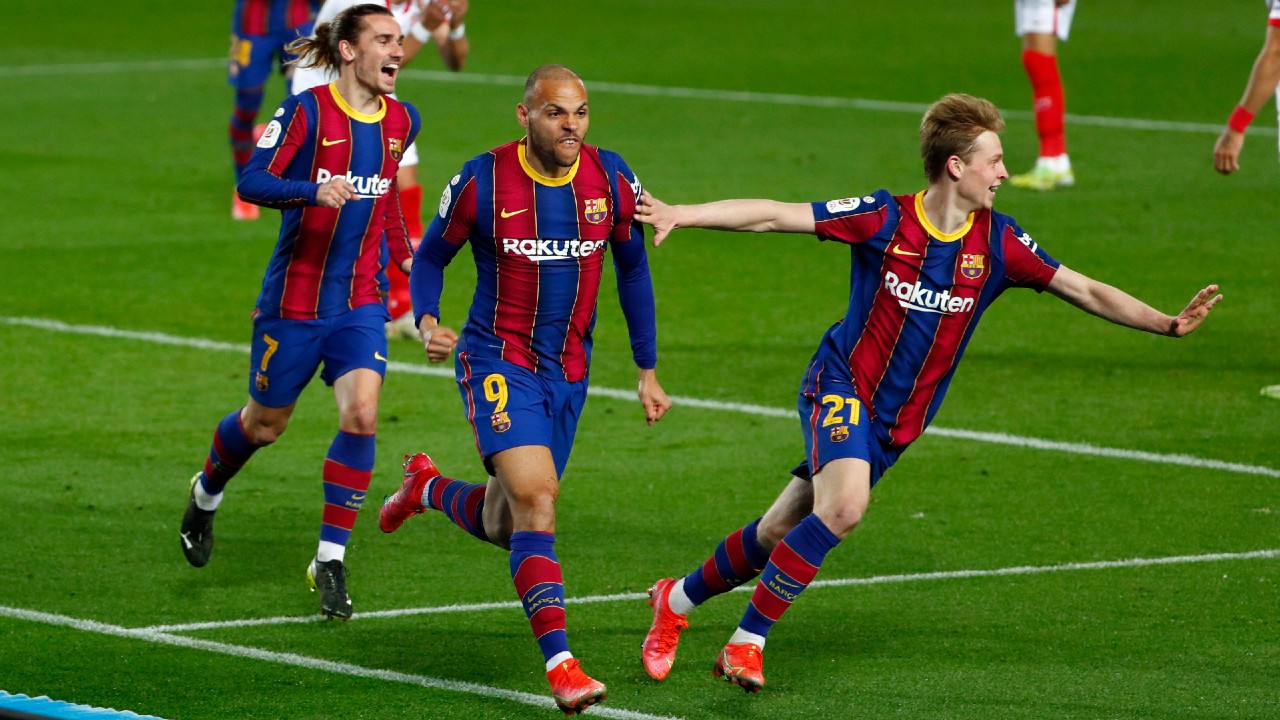 Barcelona's Martin Braithwaite, center, celebrates after scoring his side's third goal during the the Copa del Rey semifinal, second leg, soccer match between FC Barcelona and Sevilla FC at the Camp Nou stadium in Barcelona, Spain, Wednesday March 3, 2021. (Joan Monfort/AP)
