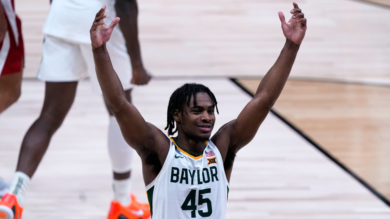 Baylor guard Davion Mitchell (45) celebrates beating Arkansas 81-72 after an Elite 8 game in the NCAA men's college basketball tournament at Lucas Oil Stadium, Tuesday, March 30, 2021, in Indianapolis. (Michael Conroy / AP)