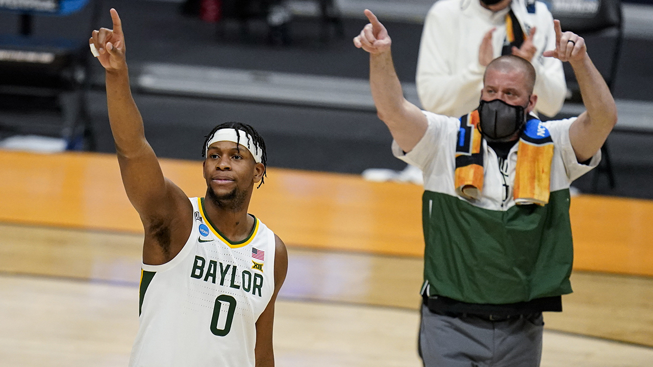 Baylor forward Flo Thamba (0) celebrates after a 76-63 win over Wisconsin in the NCAA men's college basketball tournament in Indianapolis, Sunday, March 21, 2021. (Michael Conroy/AP)