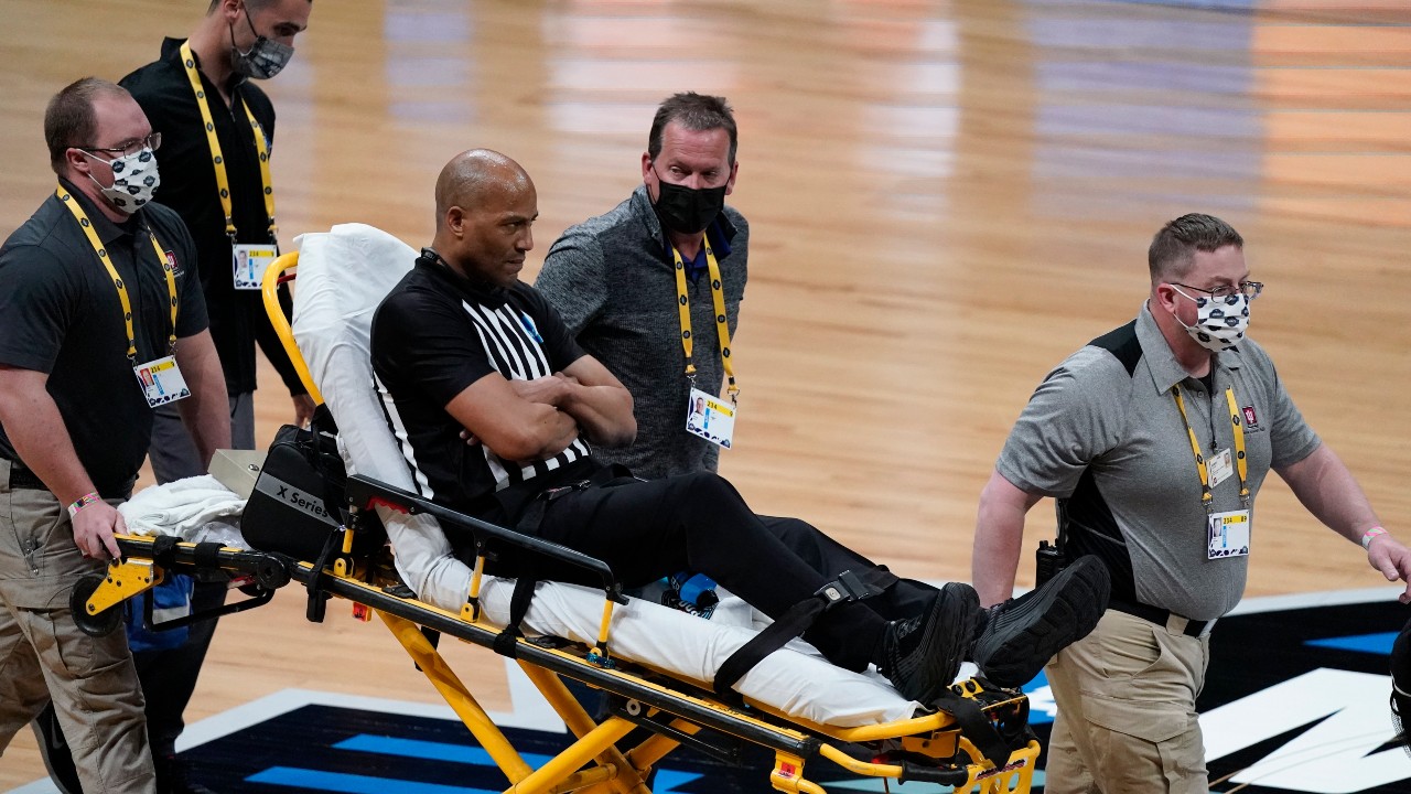 Referee Bert Smith is taken off the court on a stretcher after collapsing during the first half of an Elite 8 game between Gonzaga and Southern California during the first half of an Elite 8 game in the NCAA men's college basketball tournament at Lucas Oil Stadium, Tuesday, March 30, 2021, in Indianapolis. (Michael Conroy / AP)