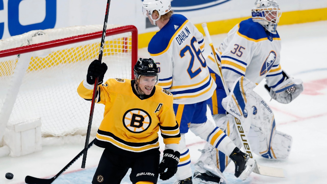 Boston Bruins' Linus Ullmark, left, celebrates with fellow goalie