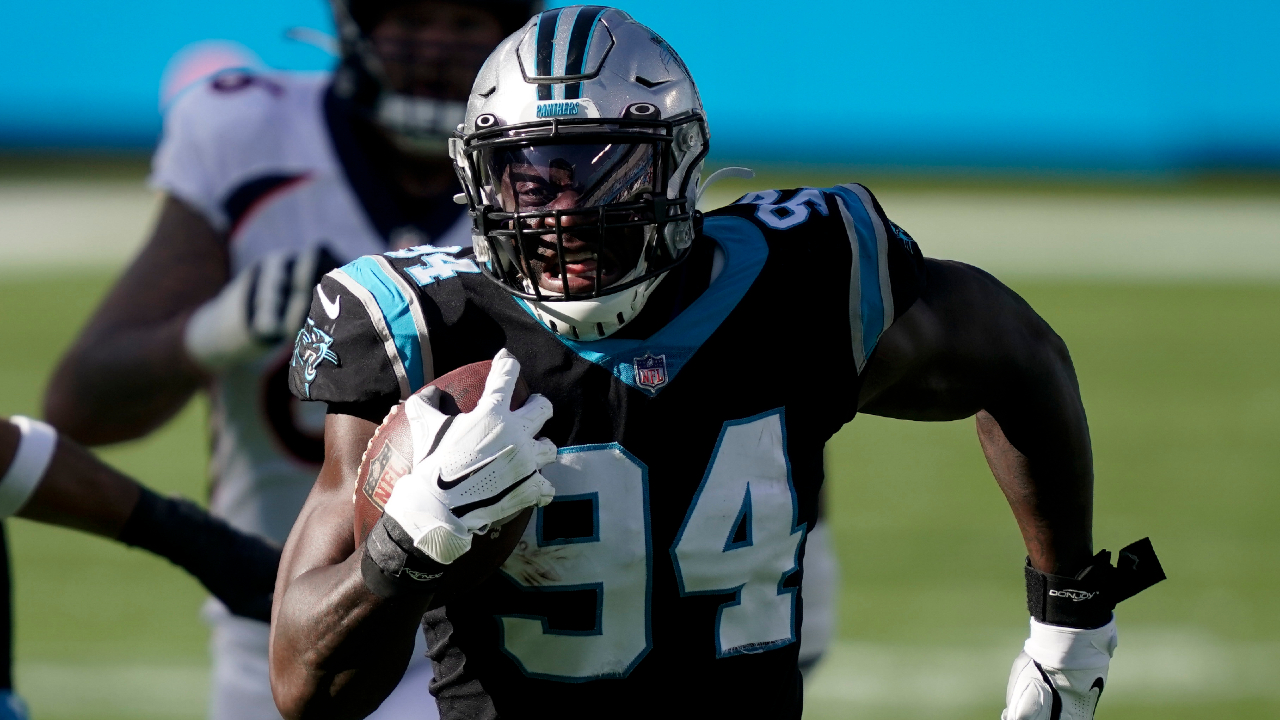 Carolina Panthers defensive end Efe Obada (94) runs after receiving a fumble during the first half of an NFL football game against the Denver Broncos Sunday, Dec. 13, 2020, in Charlotte, N.C. (AP Photo/Gerry Broome)