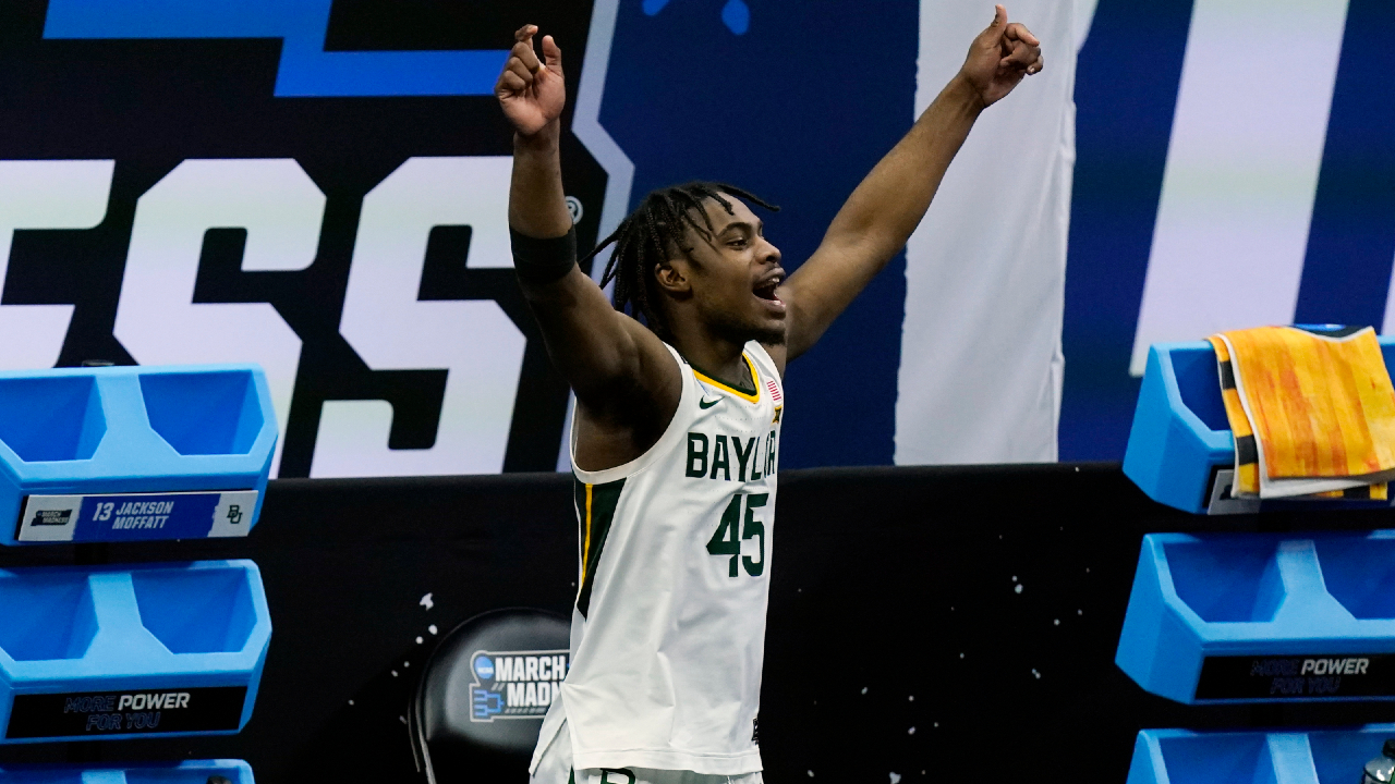 Baylor's Davion Mitchell celebrates in the final moments of a win over Hartford in a college basketball game in the first round of the NCAA tournament at Lucas Oil Stadium in Indianapolis Friday, March 19, 2021, in Indianapolis, Tenn. (AP Photo/Mark Humphrey)
