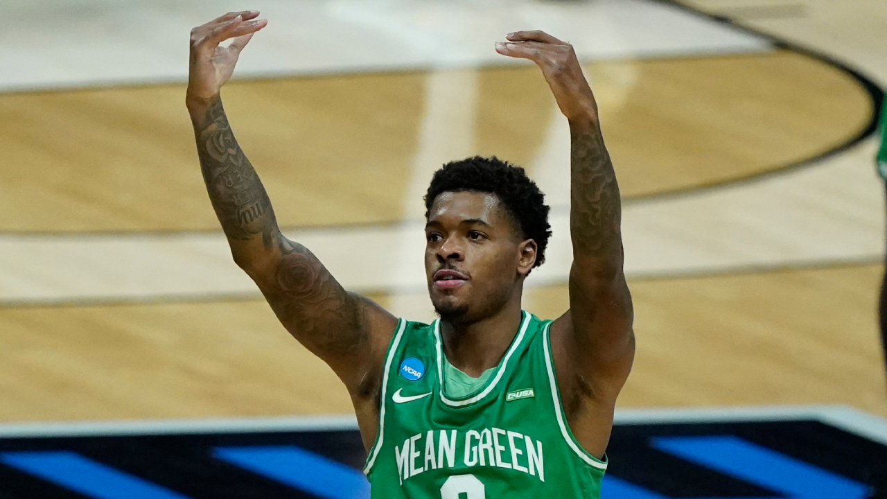 North Texas's Javion Hamlet reacts to fans during the first half of a first-round game against Purdue in the NCAA men's college basketball tournament at Lucas Oil Stadium, Friday, March 19, 2021, in Indianapolis. (AP Photo/Darron Cummings)
