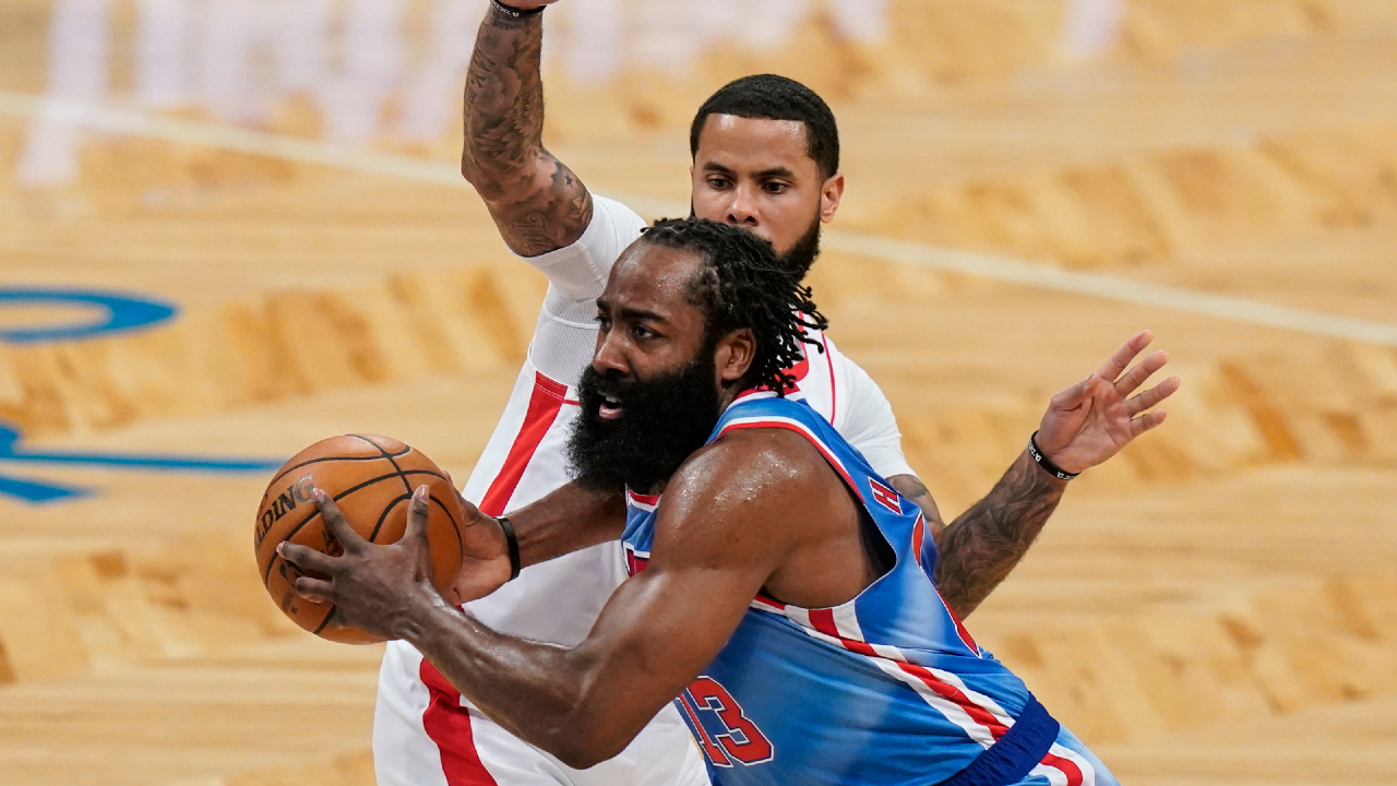 Brooklyn Nets' James Harden drives past Houston Rockets' D.J. Augustin during the first half of an NBA basketball game Wednesday, March 31, 2021, in New York. (AP Photo/Frank Franklin II)