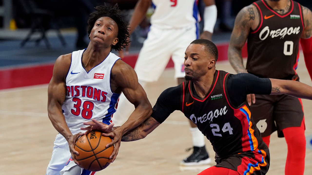 Portland Trail Blazers forward Norman Powell (24) knocks the ball away from Detroit Pistons guard Saben Lee (38) during the second half of an NBA basketball game, Wednesday, March 31, 2021, in Detroit. (AP Photo/Carlos Osorio)