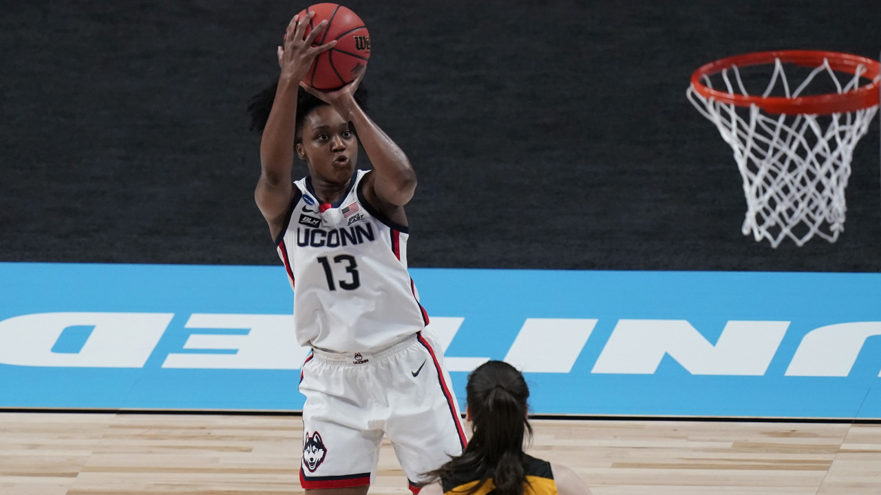 UConn guard Christyn Williams (13) shoots over Iowa guard Caitlin Clark (22) during the first half of a college basketball game in the Sweet Sixteen round of the women's NCAA tournament. (Eric Gay/AP)