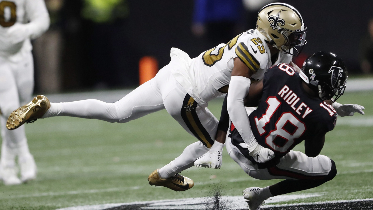 Former New Orleans Saints cornerback Eli Apple (25) tackles Atlanta Falcons wide receiver Calvin Ridley (18) during the second half of an NFL football game. (John Bazemore/AP)