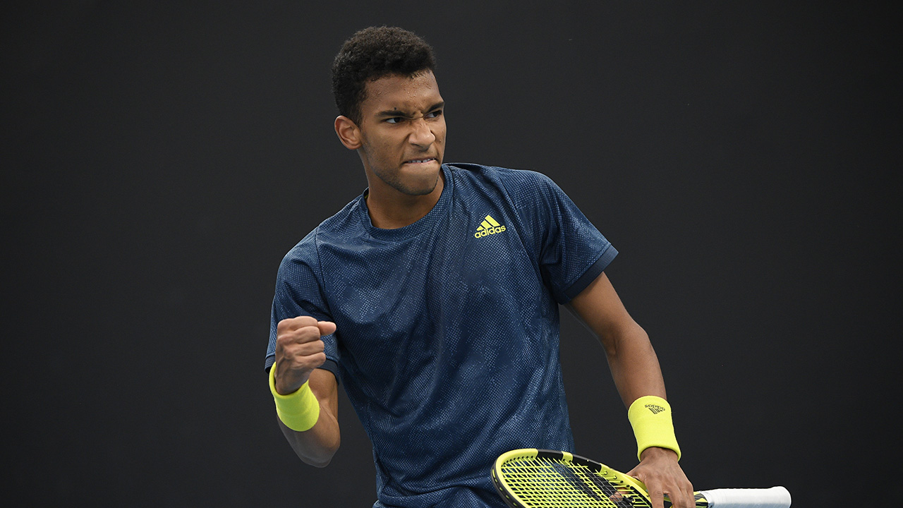 Canada's Felix Auger-Alliassime reacts after winning a point against Germany's Cedric-Marcel Stebe during their first round match at the Australian Open tennis championship in Melbourne. (Andy Brownbill/AP)