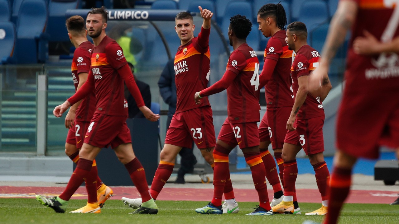 Roma's Gianluca Mancini, center, celebrates after scoring his side's first goal during a Serie A soccer match between Roma and Genoa at Rome's Olympic stadium, Sunday, March 7, 2021. (Alessandra Tarantino / AP)