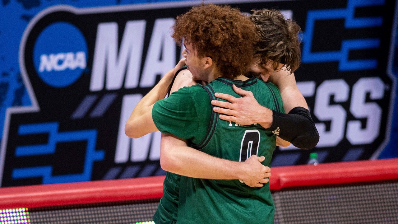Ohio guard Jason Preston (0) and forward Ben Vander Plas (5) celebrate their defeat of Virginia in a first-round game in the NCAA men's college basketball tournament, Saturday, March 20, 2021, at Assembly Hall in Bloomington, Ind. (Doug McSchooler/AP)