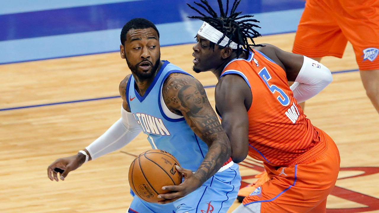 Houston Rockets guard John Wall (1) looks to drive around Oklahoma City Thunder forward Luguentz Dort (5). (Michael Wyke/AP)