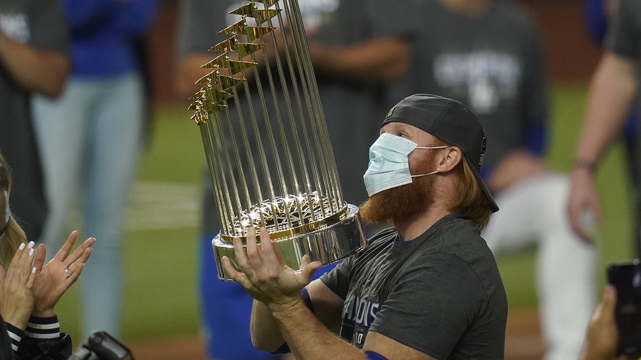 Los Angeles Dodgers third baseman Justin Turner celebrates with the trophy after defeating the Tampa Bay Rays 3-1 to win the baseball World Series in Game 6 in Arlington, Texas. (Eric Gay/AP)