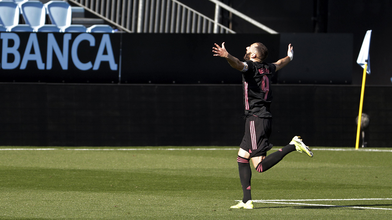 Real Madrid's Karim Benzema celebrates after scoring his side's second goal during a Spanish La Liga soccer match between Celta and Real Madrid at the Balaidos stadium in Vigo, Spain, Saturday March 20, 2021. (Lalo R.Villar/AP)