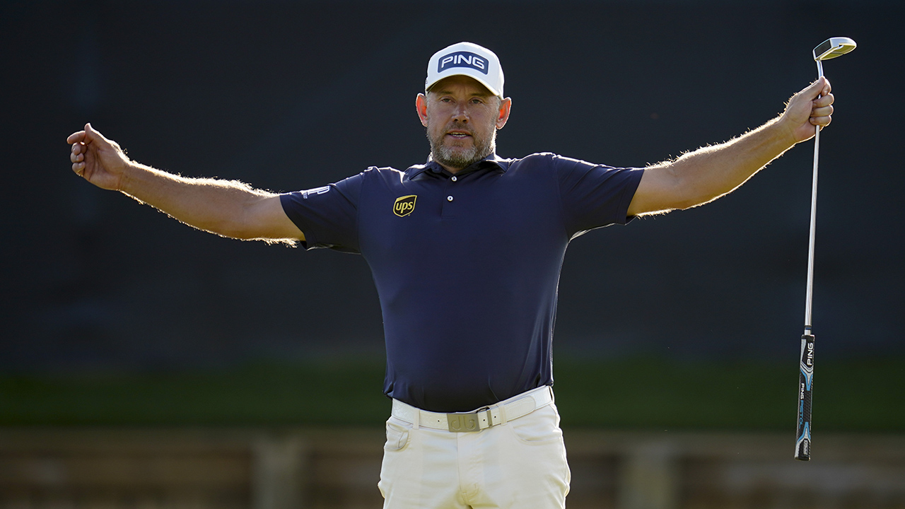 Lee Westwood, of England, celebrates after a birdie on the 18th hole during the final round of The Players Championship golf tournament Sunday, March 14, 2021. (Gerald Herbert/AP)