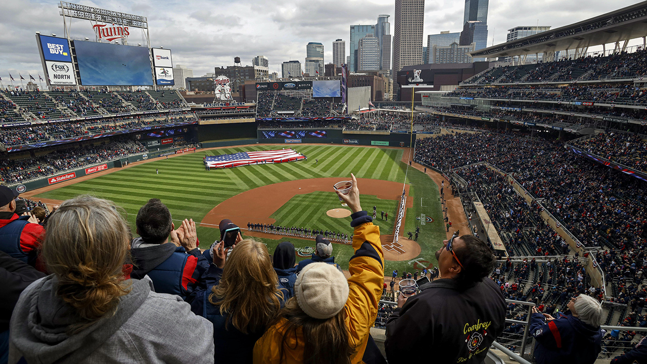 Fans get ready for a baseball game between the Cleveland Indians and the Minnesota Twins. (Bruce Kluckhohn/AP)
