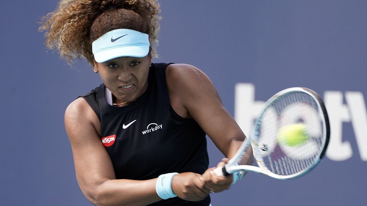 Naomi Osaka, of Japan, returns to Elise Mertens, of Beligium, during the Miami Open tennis tournament, Monday, March 29, 2021, in Miami Gardens, Fla. (Marta Lavandier/AP)