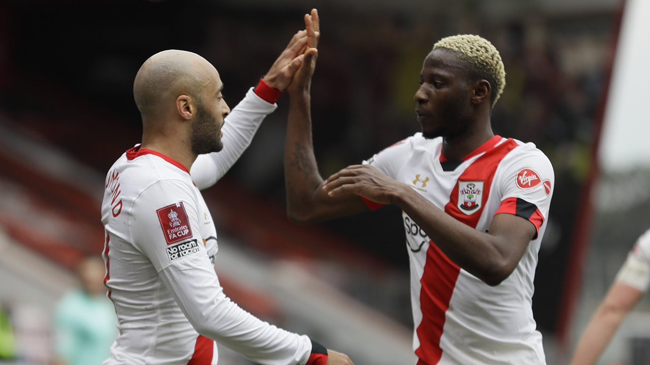 Southampton's Nathan Redmond, left, and Moussa Djenepo celebrate after scoring his side's second goal during the English FA Cup quarterfinal soccer match between Bournemouth and Southampton. (Kirsty Wigglesworth/AP)