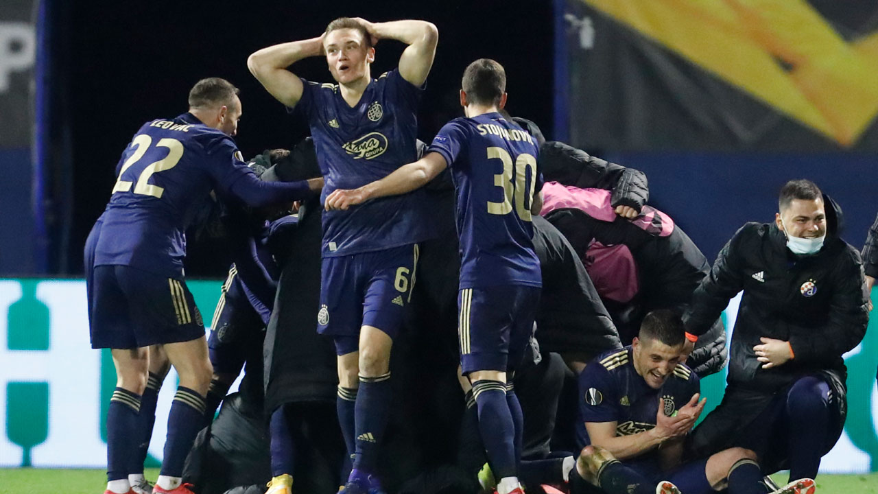 Dinamo Zagreb players celebrate after their teammate Mislav Orsic scores his side's third goal during the Europa League round of 16 second leg soccer match between Dinamo Zagreb and Tottenham Hotspur at the Maksimir stadium. (Darko Bandic/AP)