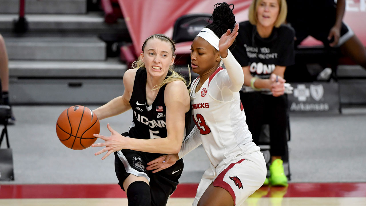 Connecticut guard Paige Bueckers (5) drives Arkansas defender Makayla Daniels (43). (Michael Woods/AP)