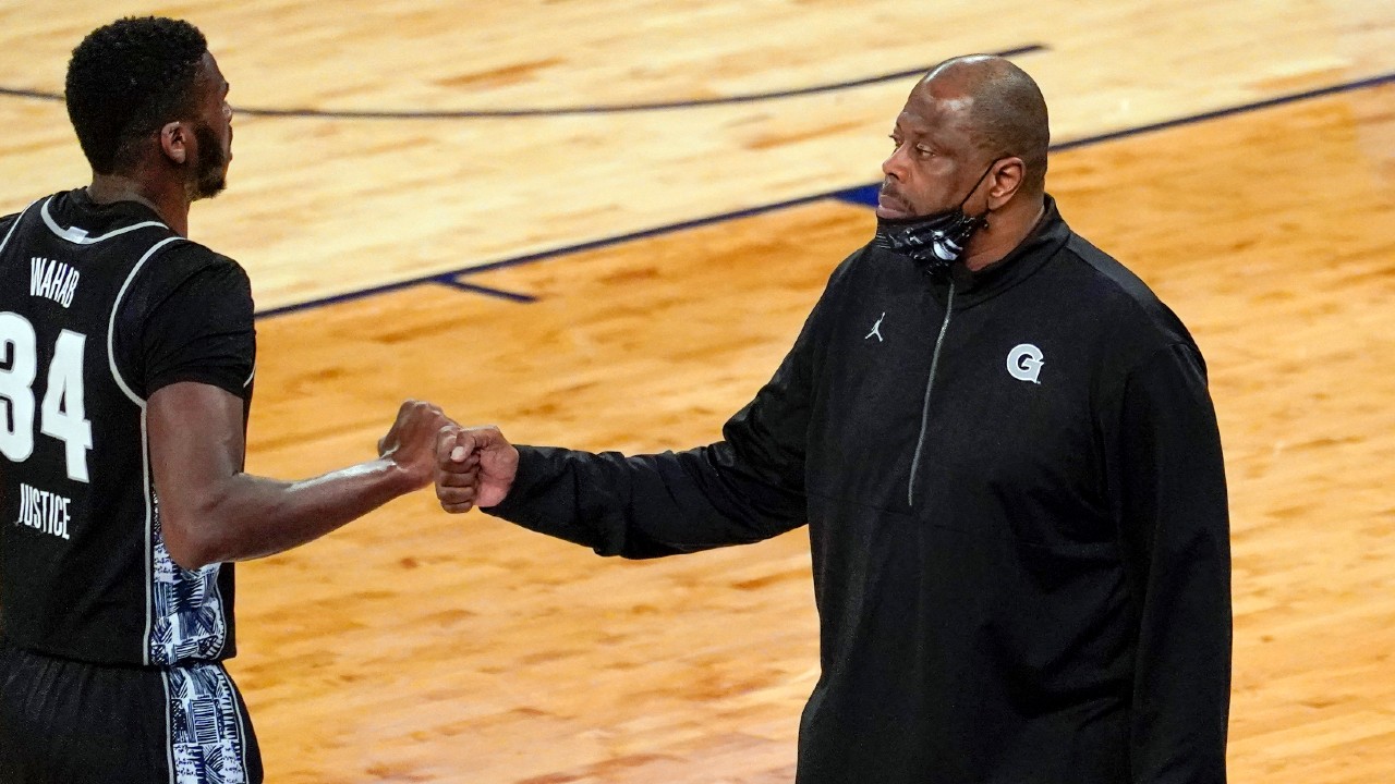 Georgetown center Qudus Wahab (34) fists bumps head coach Patrick Ewing during the first half of an NCAA college basketball game against Villanova in the quarterfinals of the Big East conference tournament, Thursday, March 11, 2021, in New York. (Mary Altaffer/AP)