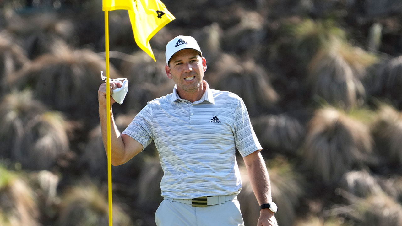 Sergio Garcia celebrates as he take his ball out of the cup after making a hole in one on the fourth hole to win his playoff against Lee Westwood during a third round match at the Dell Technologies Match Play. (David J. Phillip/AP)