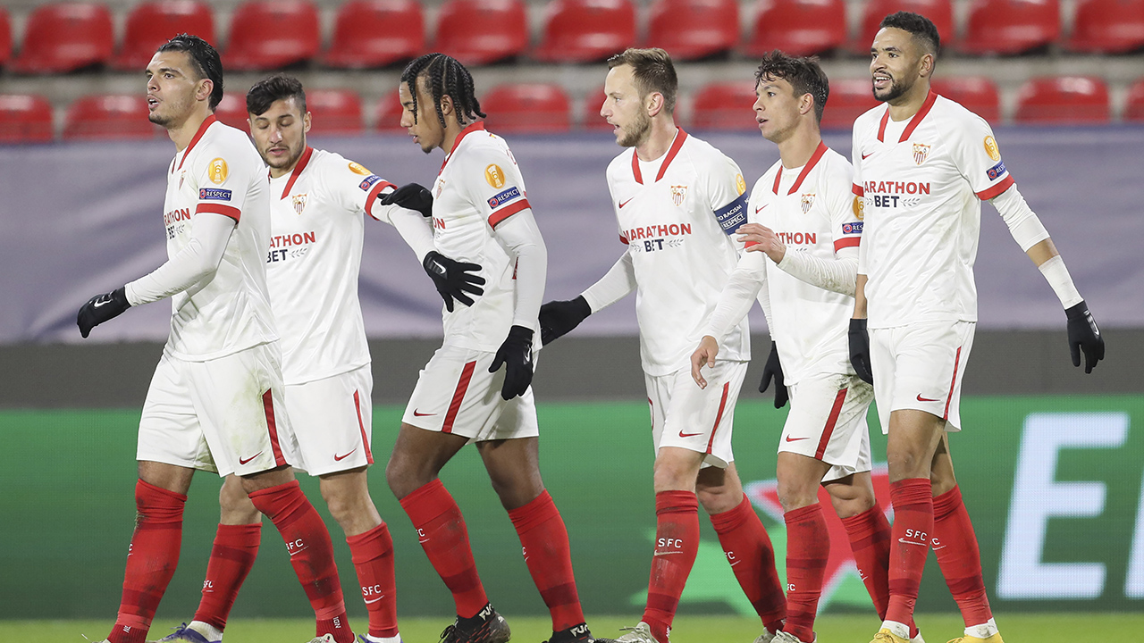 Sevilla's Youssef En-Nesyri, right, celebrates with his teammates his second goal against Rennes during the Champions League, group E soccer match between Rennes and Sevilla. (AP Photo/David Vincent)