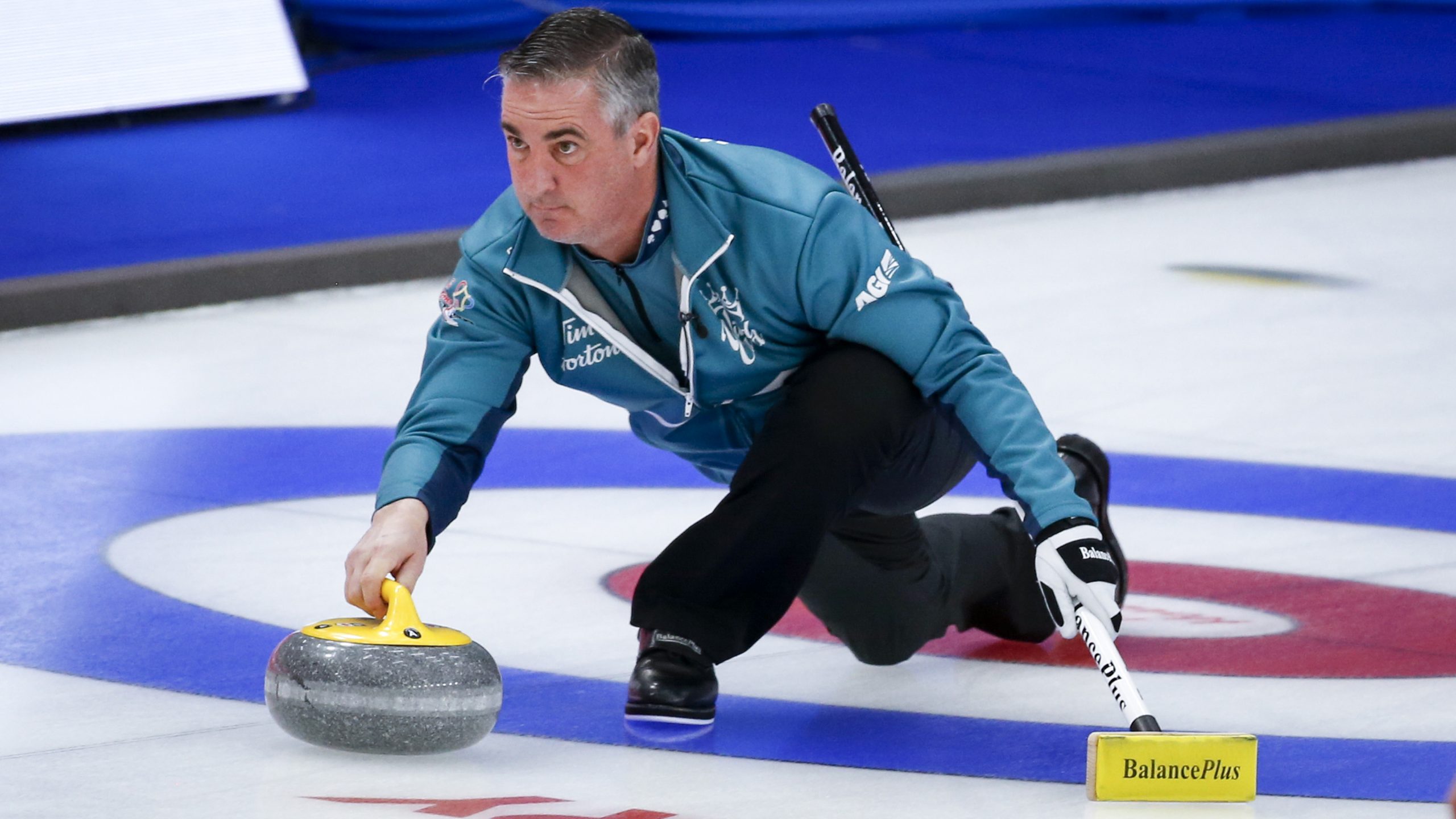 Team Wild Card Three alternate Wayne Middaugh makes a shot as he plays Team New Brunswick at the Brier in Calgary, Alta. (Jeff McIntosh/CP)