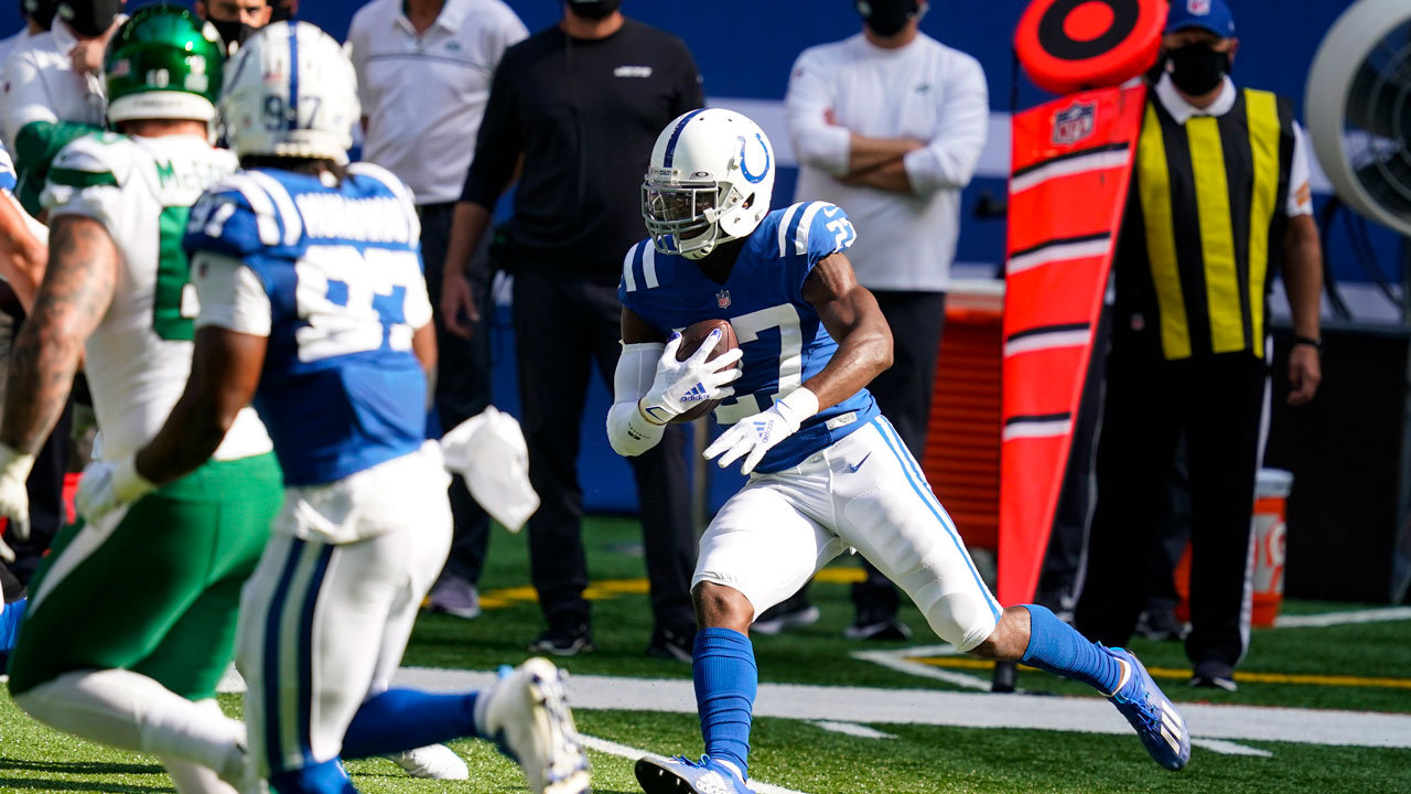 Indianapolis Colts cornerback Xavier Rhodes (27) runs back an interception for a touchdown. (Darron Cummings/AP)