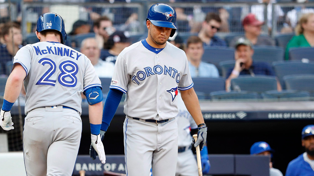 Toronto Blue Jays' Breyvic Valera congratulates Billy McKinney after a home run. (Michael Owens/AP)