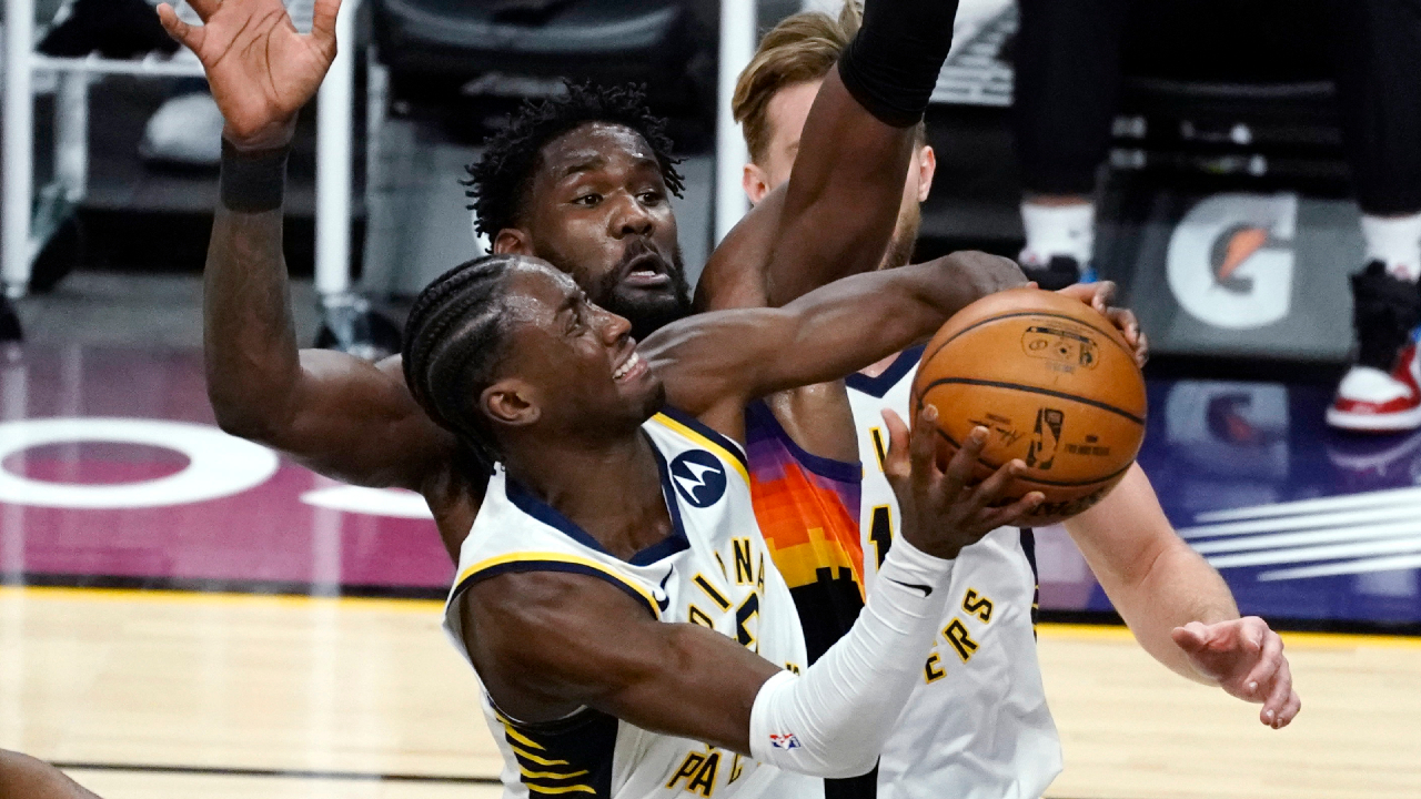 Indiana Pacers guard Caris LeVert (22) drives past Phoenix Suns center Deandre Ayton (22) during the first half of an NBA basketball game Saturday, March. 13, 2021, in Phoenix. (Rick Scuteri/AP)
