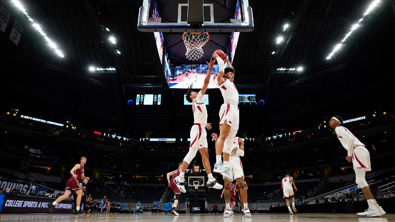 Arkansas' Justin Smith (0) grabs a rebound during a first-round men's college basketball game against Colgate in the NCAA Tournament, Friday, March 19, 2021, at Bankers Life Fieldhouse in Indianapolis. (Jack Dempsey/Pool Photo via AP)
