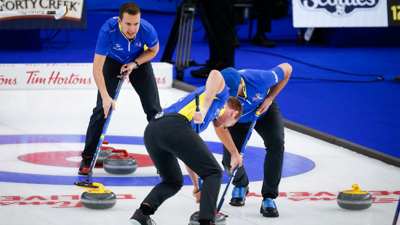 Team Alberta skip Brendan Bottcher, left, directs his team as he plays Team Wild Card Three at the Brier in Calgary, Alta., Monday, March 8, 2021. (THE CANADIAN PRESS/Jeff McIntosh)