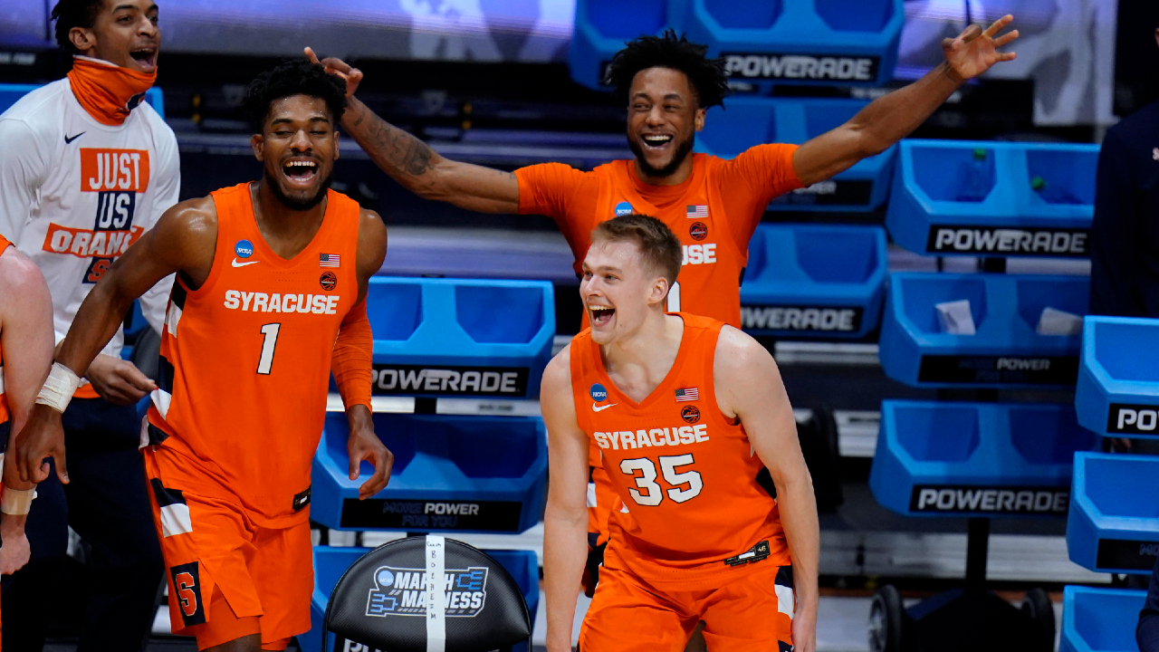 Syracuse's Quincy Guerrier (1), Buddy Boeheim (35) and Alan Griffin celebrate a teammate's 3-point shot late in the second half against San Diego State in a college basketball game in the first round of the NCAA men's tournament at Hinkle Fieldhouse in Indianapolis, Friday, March 19, 2021. (AP Photo/AJ Mast)